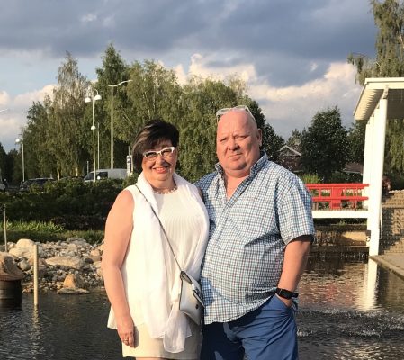 Tapio and Irja, founder of MEDI Connection with a picturesque view of Finland behind.